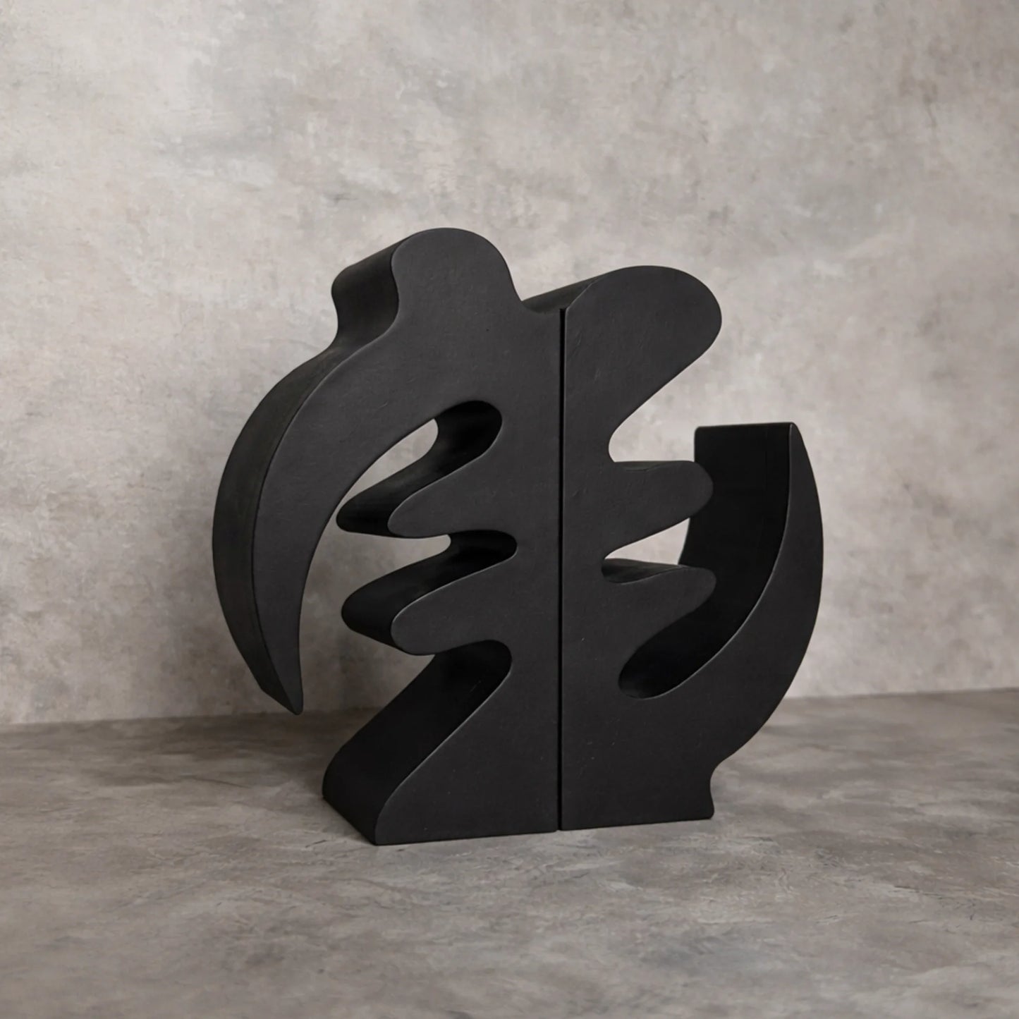 Black Gye Nyame Adinkra Bookends on grey background