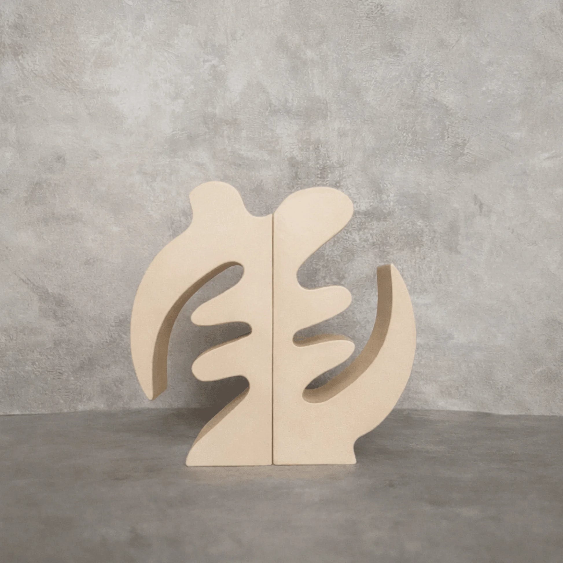 Beige Gye Nyame Adinkra Bookends on grey background