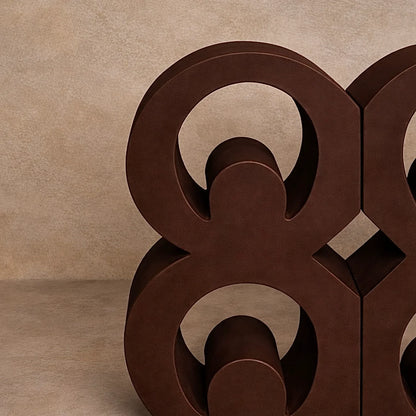 Brown close up of Mate Masie Adinkra bookends