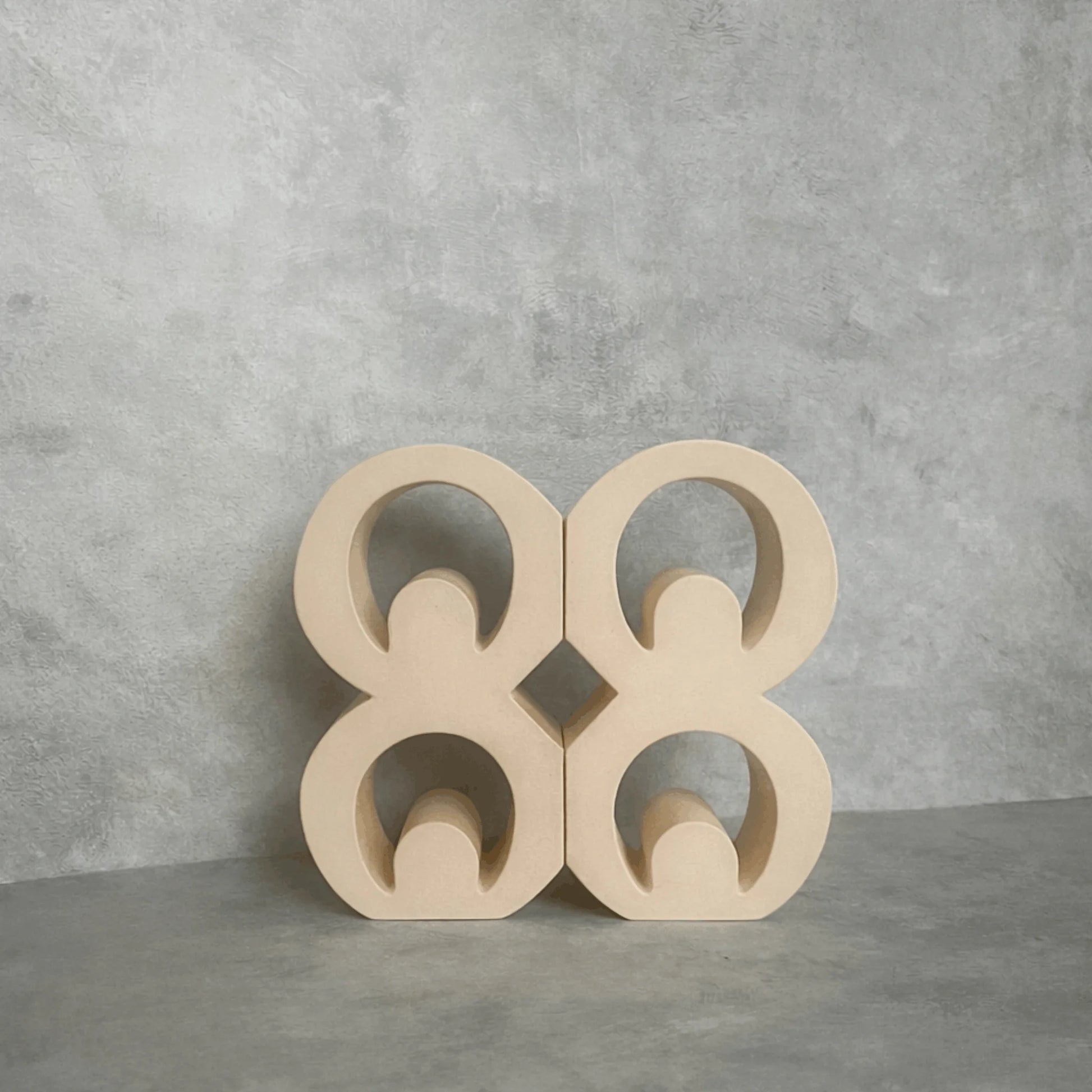Beige Mate Masie Adinkra Bookends on grey background