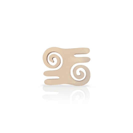 cream coloured Atiko adinkra coaster on white background.