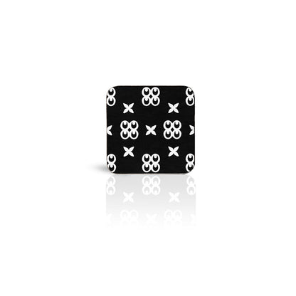 black Mate Masie adinkra square wooden coaster on white background.