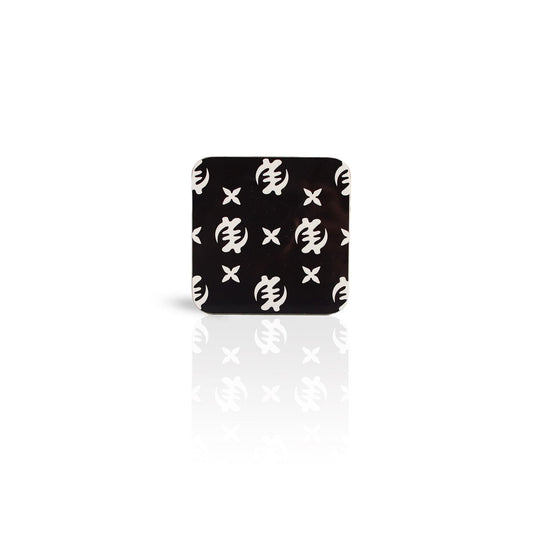 black coloured Gye Nyame adinkra wooden coaster on white background. 
