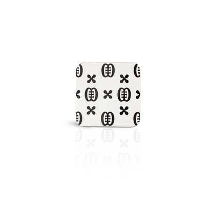 white coloured Ese Ne Tekrema adinkra wooden coaster on white background.